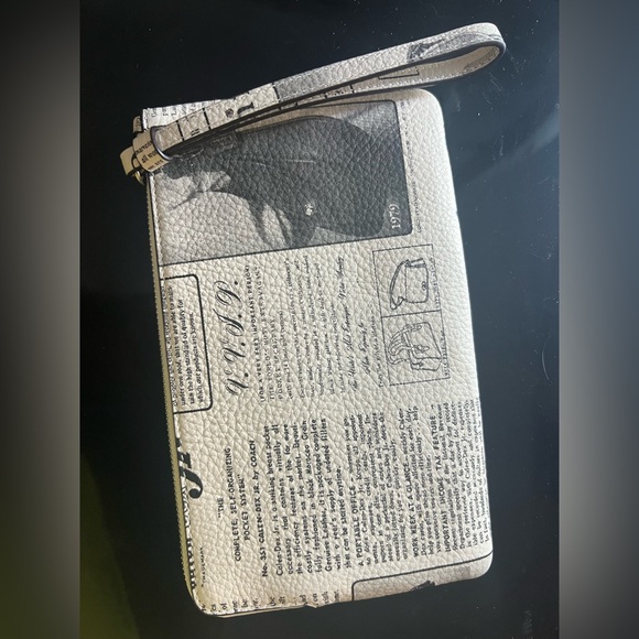 Coach Newspaper print Leather Clutch